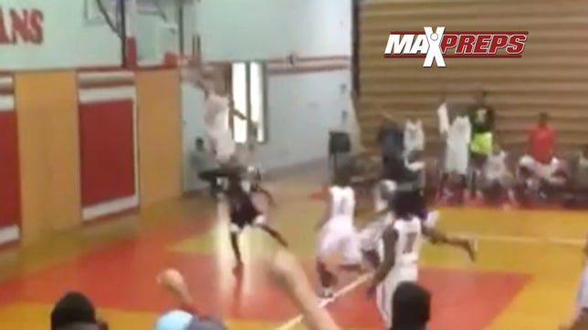 6-foot-2 senior guard D.J. Sharp of East Bay (FL) jumps over Strawberry Crest defender coming in late with his attempt to strip the ball.