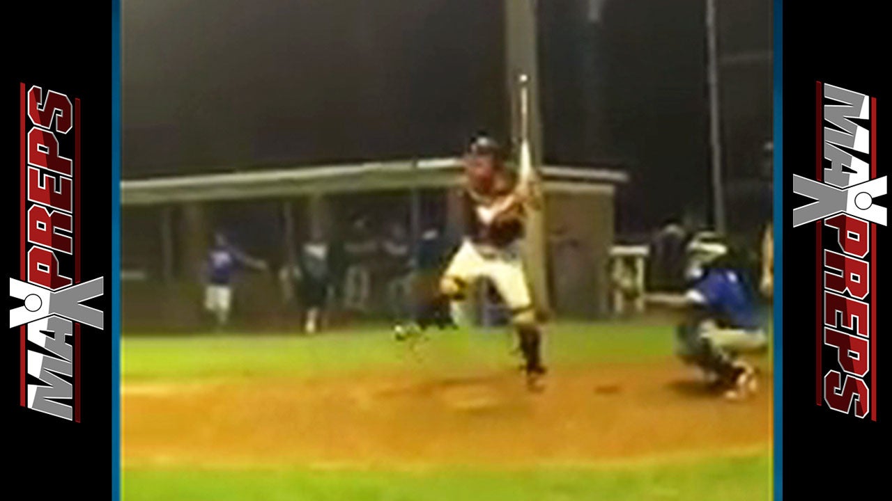 Catcher Hits in Full Gear and Bat Upside Down