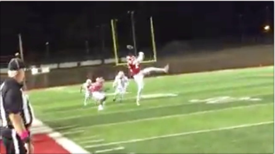 WR Carlos Hunt lucks out as he catches the tipped pass and then takes it all the way for the TD.