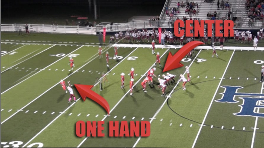 Brayden Elliott (5'11, 290-pound 9th grader) of Lakeside Junior High (Arkansas) throws ball to 6-foot, 230-pound 9th grader Harrison Morgan.  Courtesy of Lakeside Football.