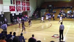 Mitchell Robinson goes under for the reverse slam