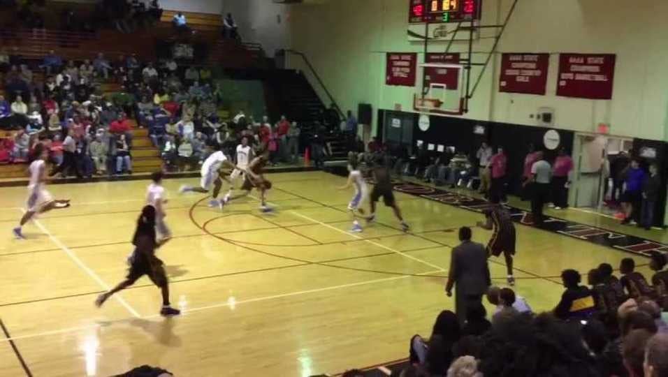 Robert Woodard splits defenders and throws it down