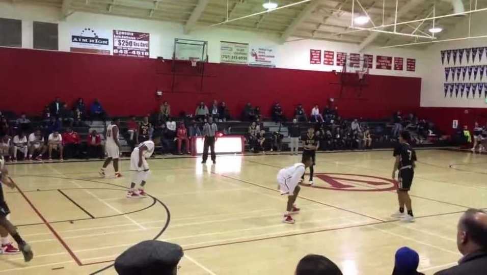 Malik Ghiden driving for layup