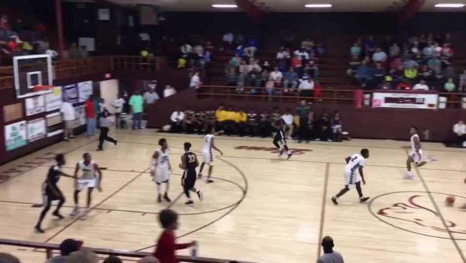 DaQuan Smith with a spin move and scoop shot