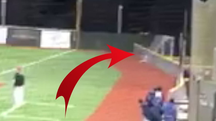 Jack Boysen of Squalicum (Bellingham, WA) makes a game-saving catch to preserve the win, all while crashing into the foul line fence.
