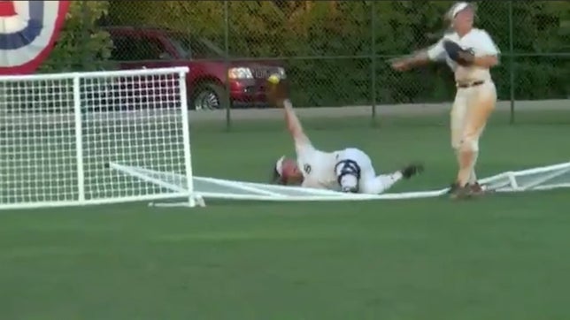 This remarkable catch by Abbey Bice of Sumiton Christian (AL) was ruled a home run because she broke through the fence while diving. You be the judge. Was this a catch or a home run?