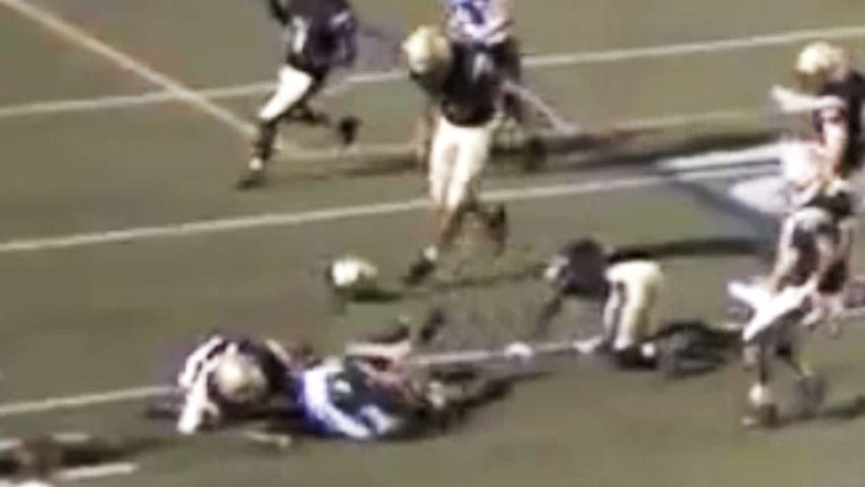 Quarterback makes defender's helmet fly off