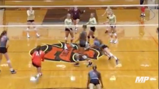 Paige Conklin of LaPorte (IN) lays out and makes a spectacular save, leading to a point for her team.