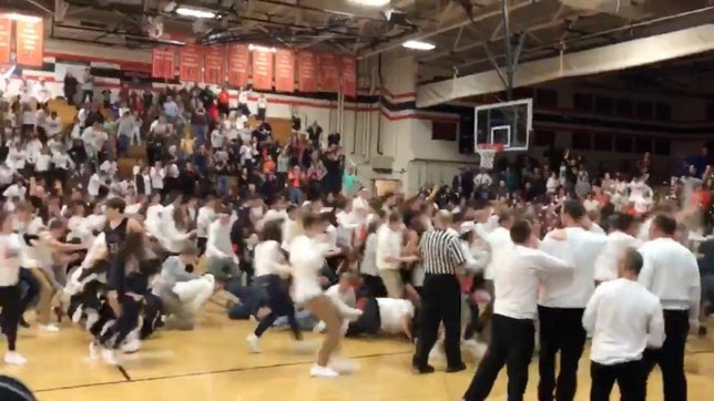 If any play deserves a court storm, it is this incredible three-point heave by Justin Hardy of St. Charles East (IL). Hardy grabs the loose ball, turns around and chucks up the game-winner. Then, absolute madness occurs.
