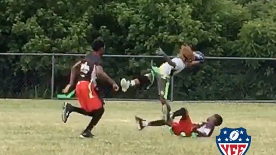 Can you believe this kid is only 10-years-old? Jack Esridge IV reaches full extension while falling backwards and somehow hangs on for the grab a la Odell Beckham Jr.