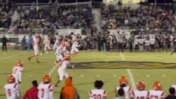 Kwa'Shawn Moore #55 break blocks and make tackle