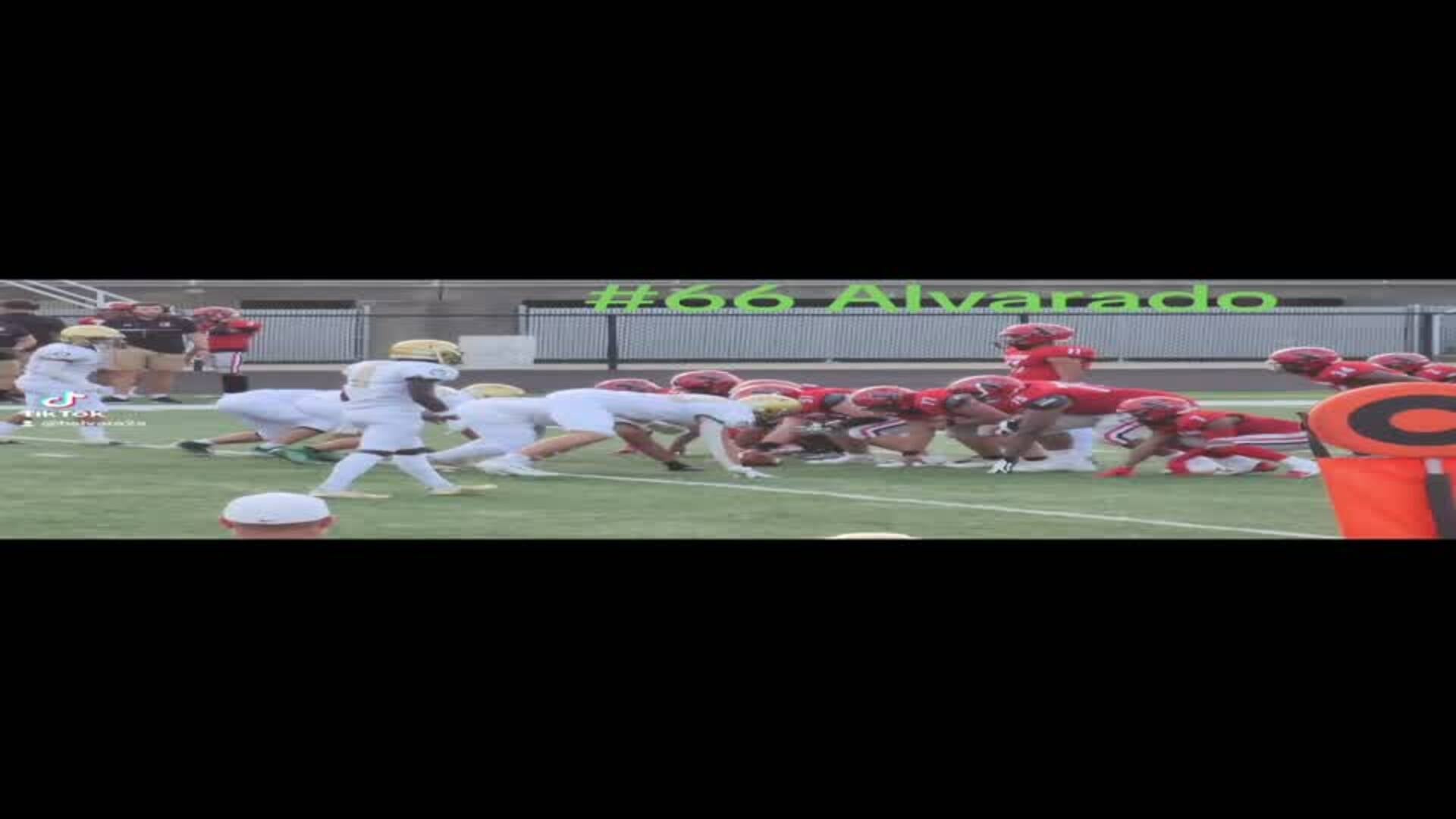 Abe Alvarado brings down East ball carrier