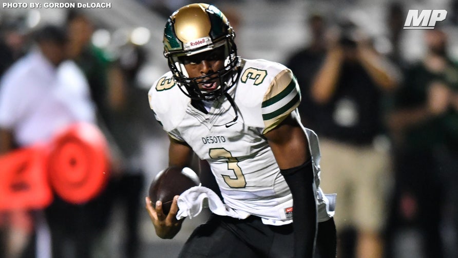 DeSoto's (TX) 4-star quarterback Shawn Robinson spins through a would-be tackler and takes it up the middle for the touchdown against Duncanville (TX).