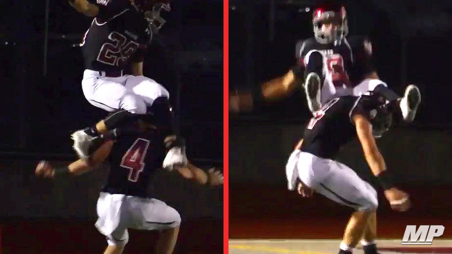 Hank Pladson of Eastlake (WA) makes a circus catch behind defender's back for TD