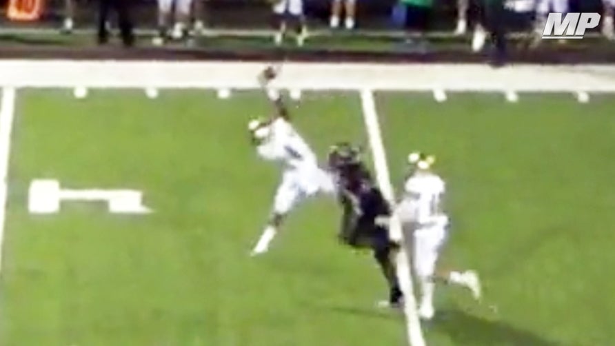 Knoxville Catholic's (TN) D.J. Mitchell pulls off the interception of the year with this one-handed pick.
