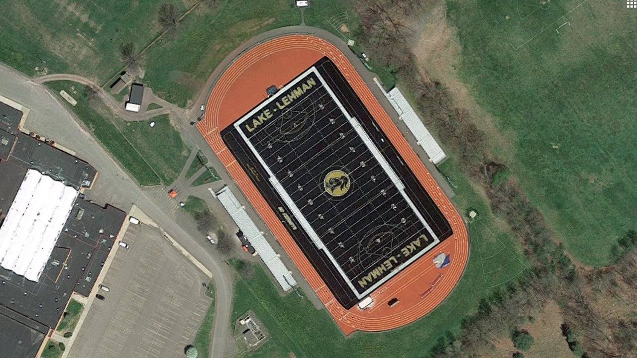 HS football team plays on black turf