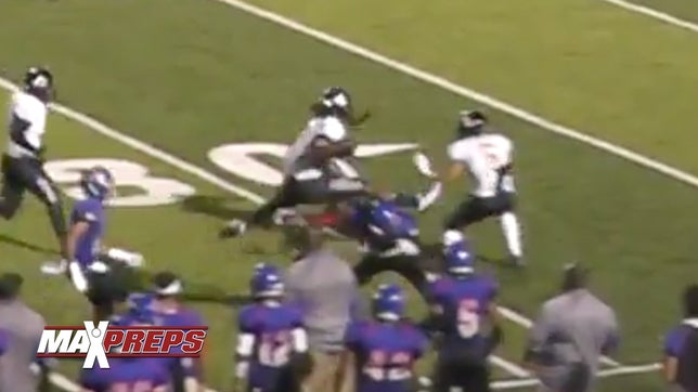 Antioch's (CA) five-star running back Najee Harris leaps over a San Leandro (CA) defender and takes it to the house.
