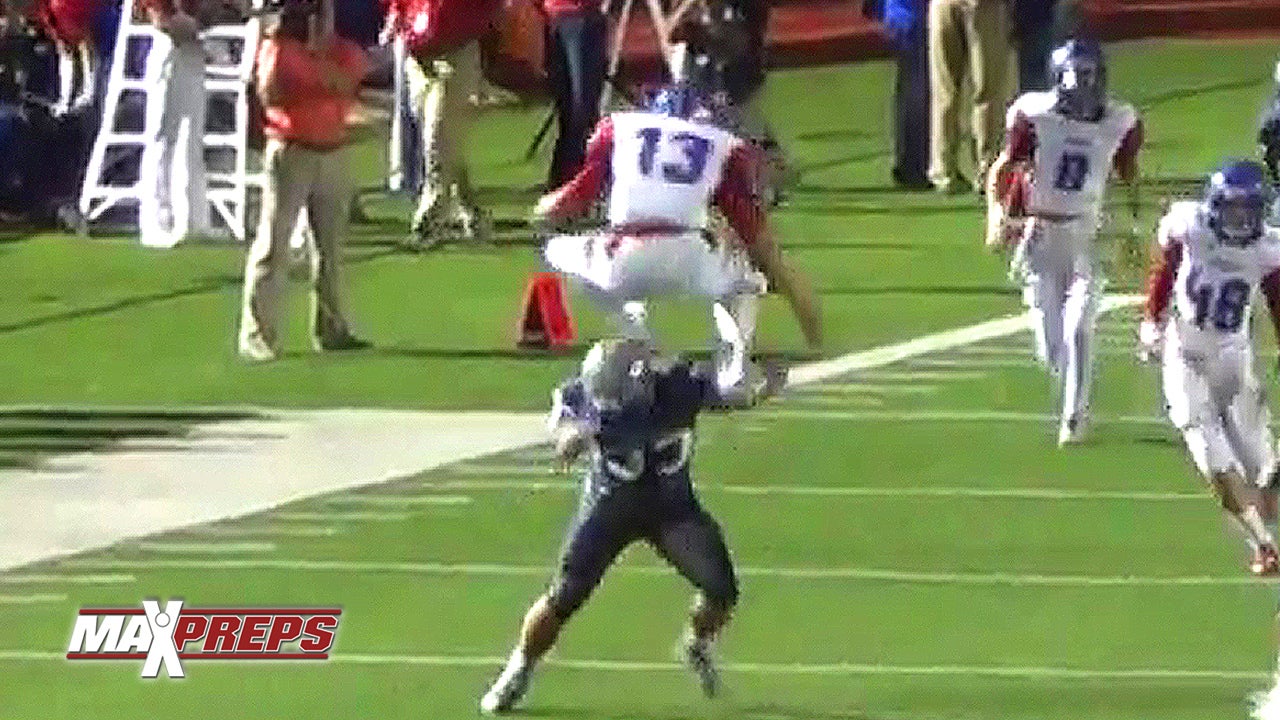 QB clears defender on hurdle