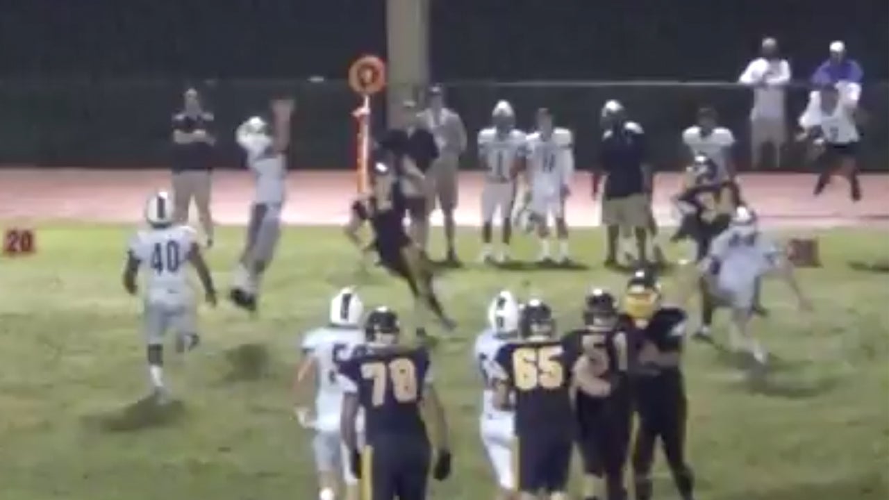 Ball tips off two defenders resulting in touchdown