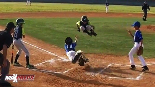 Devin Avedissian leaps over the catcher to score another run in the decisive inning of the semifinal; San Marcos Wood Bat Tournament March 2015.
