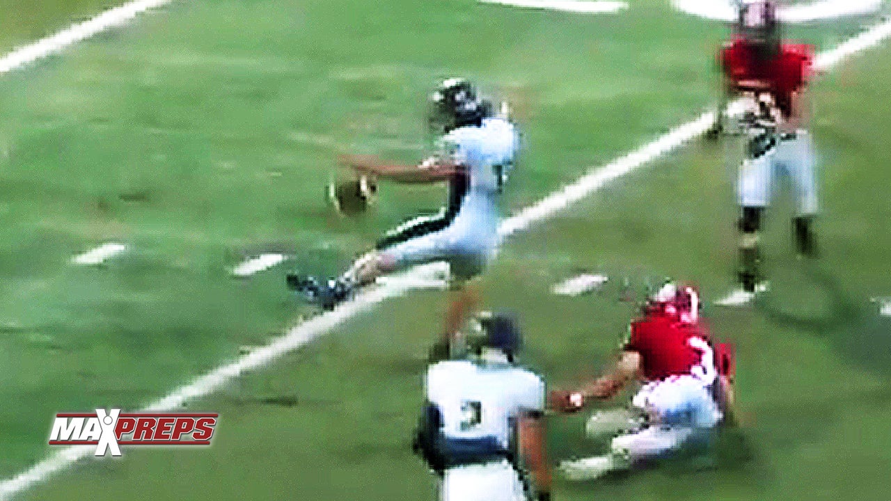 High school football player kicks pass into teammate's hands for interception