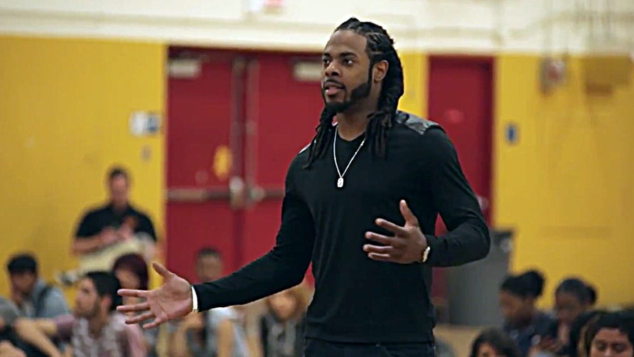 Seahawks all pro cornerback and Compton Dominguez alumni Richard Sherman wants to change the perception of his hometown and is doing so one kid at a time, one school at a time.