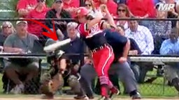 Softball player breaks bat in half