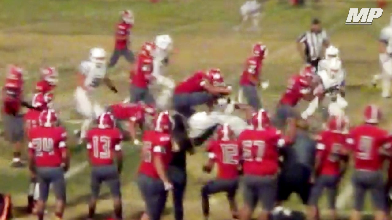 Defender strips WR & LEAPS over would be tackler