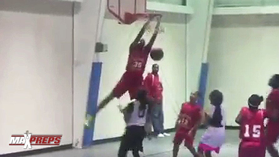 11-year-old Ashlyn Watkins dominates with four dunks in one game.