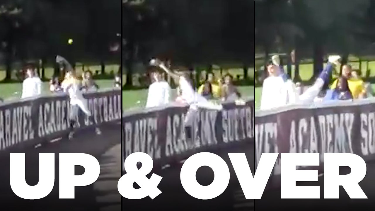 Jumps over fence for catch