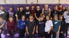 Kirtland Central Broncos Boys Varsity Wrestling Winter 21-22 team photo.